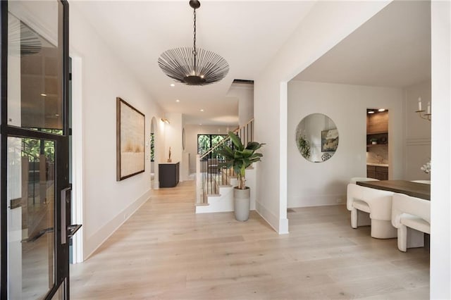 3292 Lenox Pl NE, Atlanta, GA 30324 - hall with a chandelier, stairs, light wood finished floors, and recessed lighting