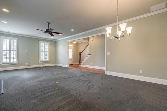 spare room with carpet floors, crown molding, baseboards, and stairs