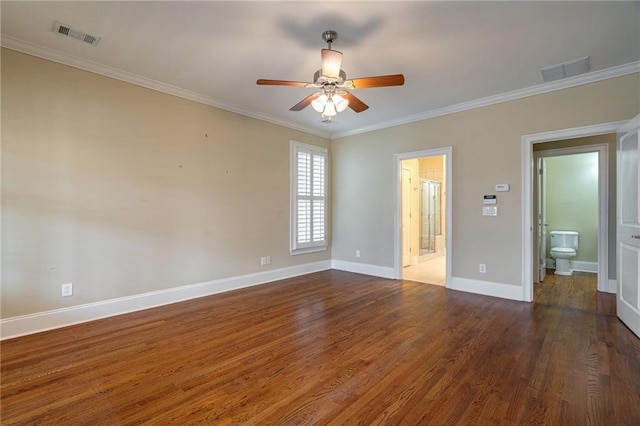 unfurnished bedroom with crown molding, baseboards, connected bathroom, and wood finished floors