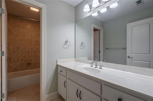 bathroom featuring visible vents, baseboards,  shower combination, tile patterned flooring, and vanity