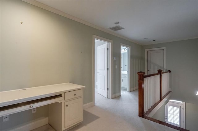 unfurnished office featuring light carpet, baseboards, visible vents, and crown molding