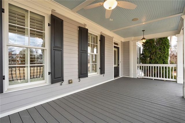 deck featuring covered porch and ceiling fan