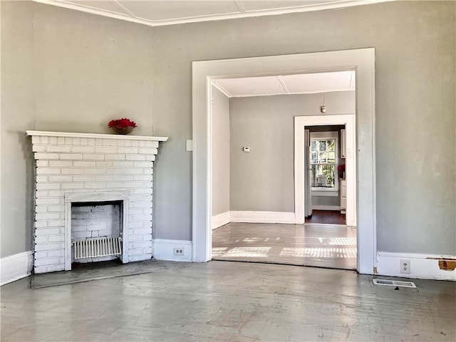 unfurnished living room with a fireplace, hardwood / wood-style flooring, and crown molding