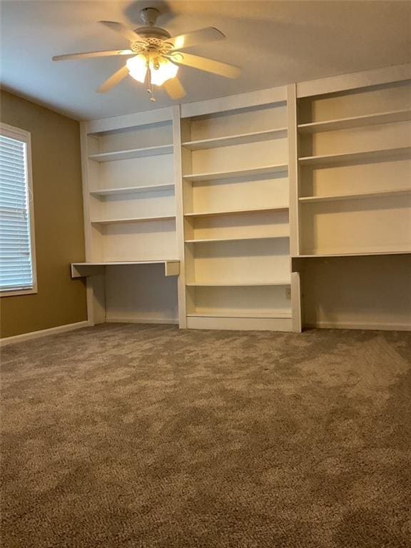 unfurnished bedroom featuring a ceiling fan and carpet flooring