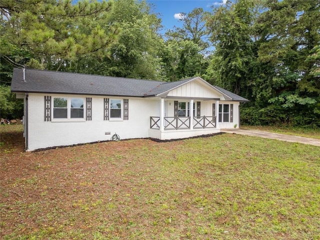 8535 Hiram Acworth Hwy, Dallas, GA 30157 - view of front of house featuring covered porch, a front yard, board and batten siding, brick siding, and view of scattered trees