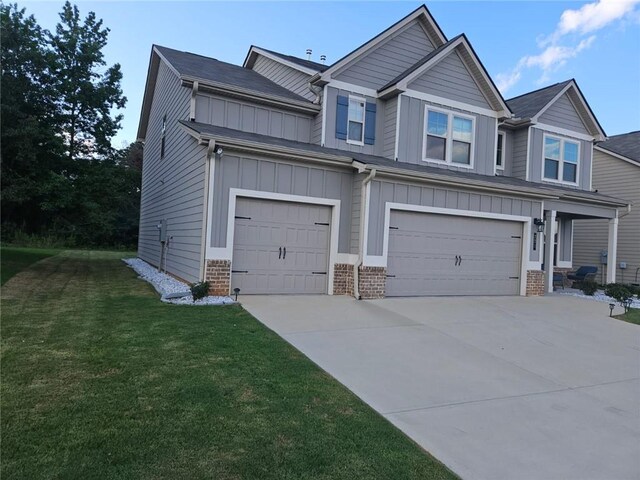 view of front of house with a garage and a front yard