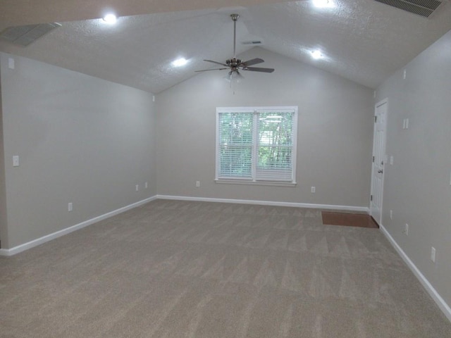 152 Royal Oaks Ln, Dahlonega, GA 30533 - empty room featuring light colored carpet, a ceiling fan, vaulted ceiling, baseboards, and a textured ceiling