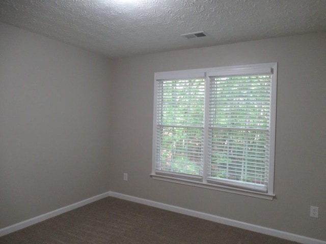 152 Royal Oaks Ln, Dahlonega, GA 30533 - empty room featuring baseboards, a textured ceiling, and dark carpet