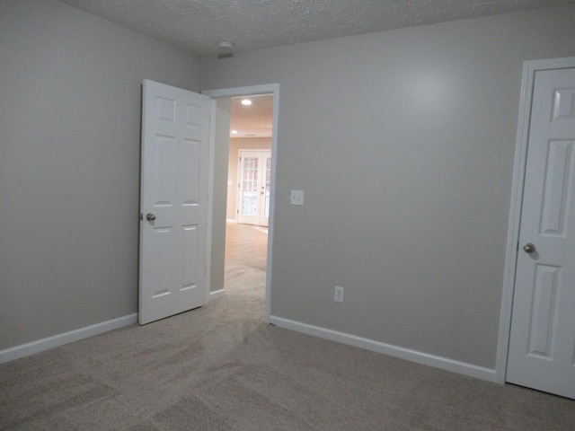152 Royal Oaks Ln, Dahlonega, GA 30533 - unfurnished room featuring light colored carpet, baseboards, and a textured ceiling