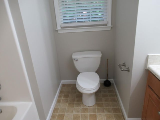 152 Royal Oaks Ln, Dahlonega, GA 30533 - bathroom with vanity, toilet, tile patterned flooring, and baseboards