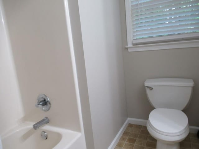 152 Royal Oaks Ln, Dahlonega, GA 30533 - bathroom with toilet,  shower combination, and baseboards