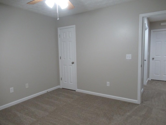 152 Royal Oaks Ln, Dahlonega, GA 30533 - spare room with carpet floors, a ceiling fan, and baseboards