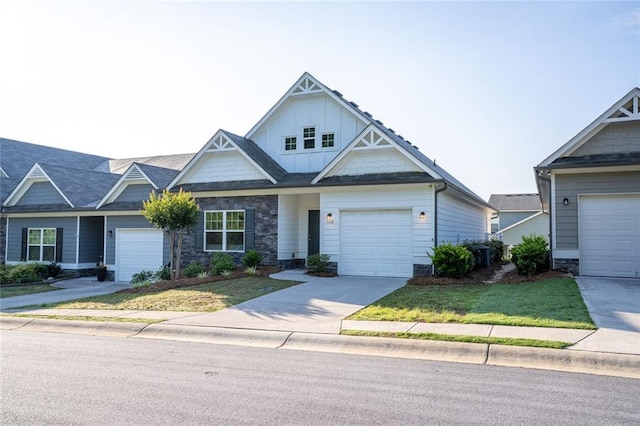 155 Sanctuary Pl, Jasper, GA 30107 - view of front facade with board and batten siding, stone siding, a front lawn, and driveway