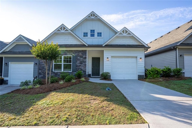 155 Sanctuary Pl, Jasper, GA 30107 - view of front of house with board and batten siding, stone siding, a front lawn, and concrete driveway