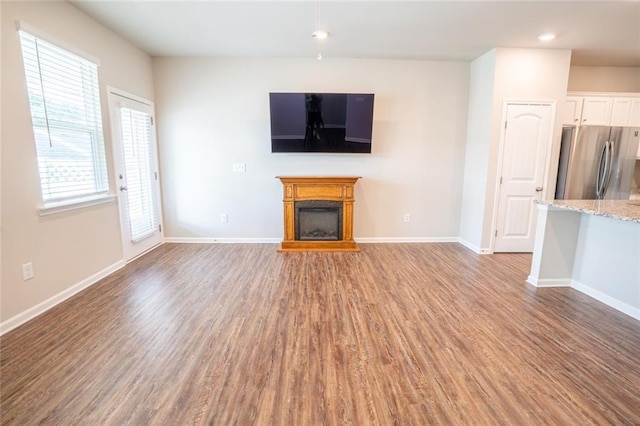 155 Sanctuary Pl, Jasper, GA 30107 - unfurnished living room with a fireplace, light wood-type flooring, and recessed lighting