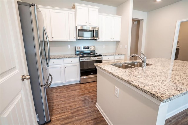 155 Sanctuary Pl, Jasper, GA 30107 - kitchen with appliances with stainless steel finishes, dark wood-style floors, white cabinetry, and light stone counters