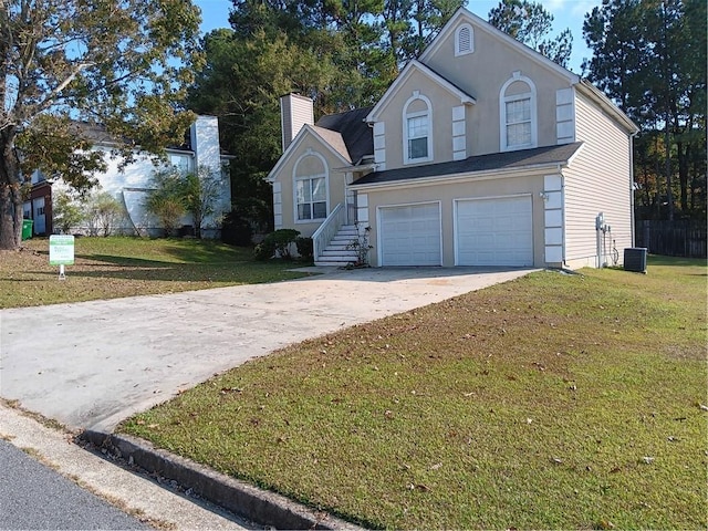 front of property featuring a front yard and a garage