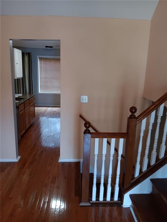 stairs featuring wood-type flooring