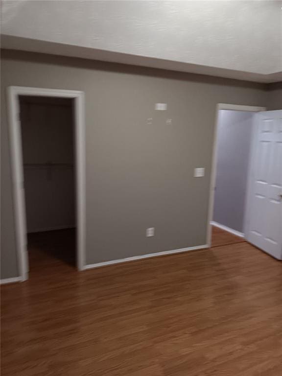 empty room featuring dark hardwood / wood-style flooring