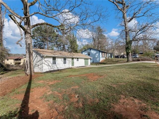 exterior space with a garage and a front yard