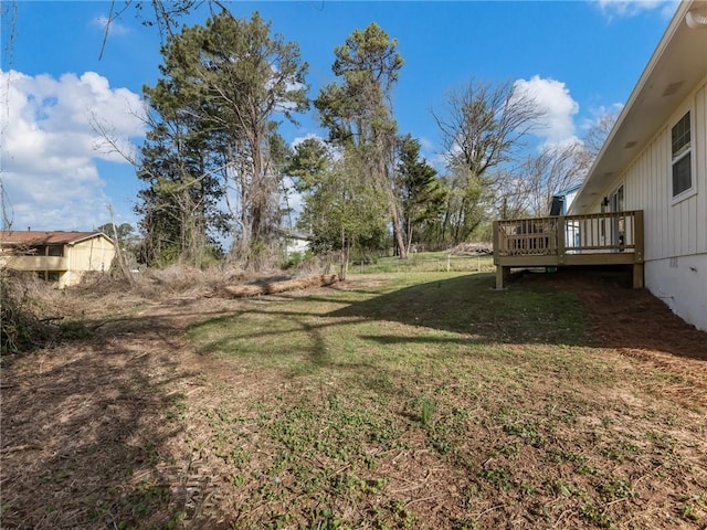 view of yard with a wooden deck