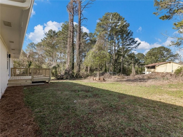 view of yard featuring a deck