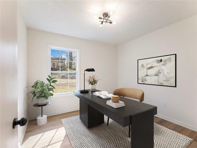 office featuring light wood finished floors and baseboards