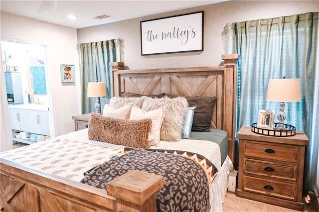 bedroom featuring connected bathroom, carpet floors, visible vents, and recessed lighting