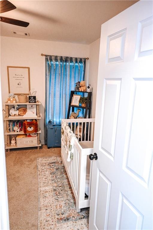 bedroom with carpet and a ceiling fan