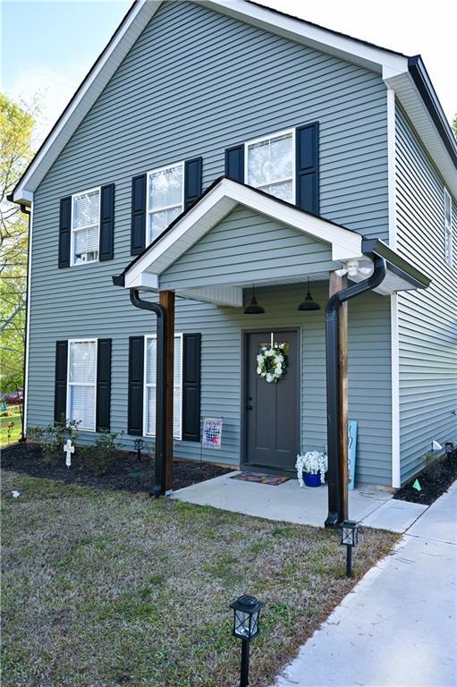 traditional-style home featuring a porch