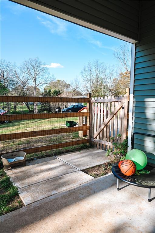 exterior space with fence and a gate