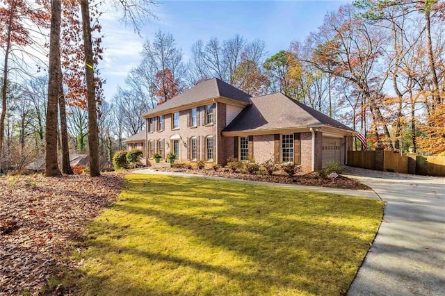 view of front facade featuring a garage and a front lawn