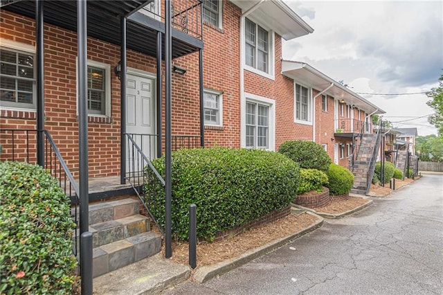 property entrance with brick siding