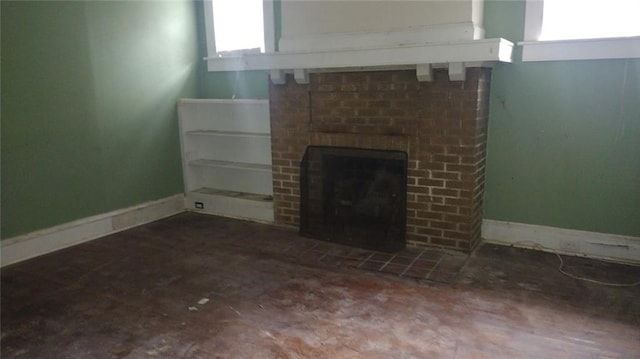 unfurnished living room with a brick fireplace