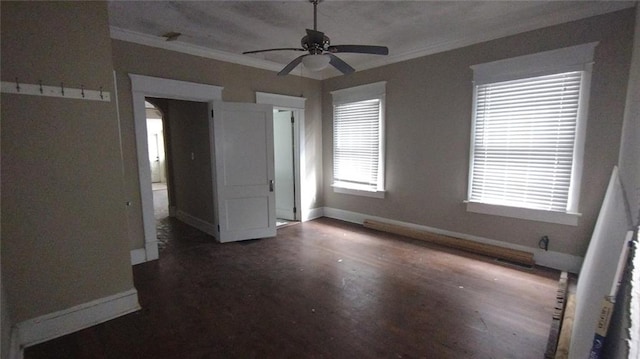 interior space with dark hardwood / wood-style flooring, ornamental molding, and ceiling fan