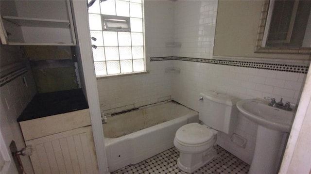 bathroom featuring tile flooring, tasteful backsplash, tile walls, tiled shower / bath, and toilet