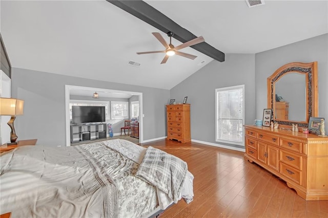 bedroom featuring lofted ceiling with beams, ceiling fan, and light hardwood / wood-style floors