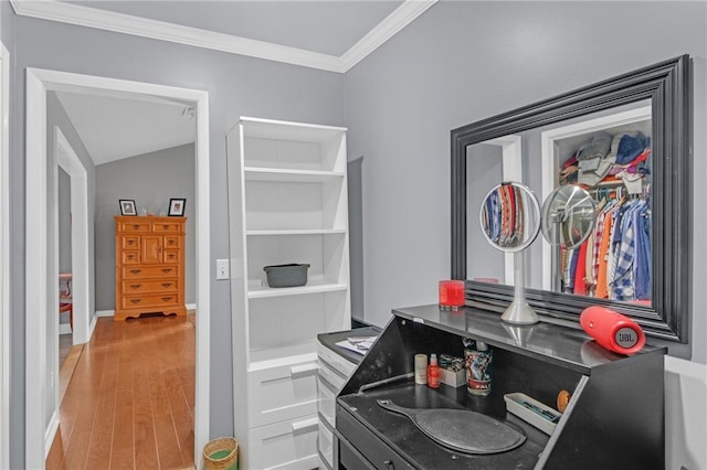 interior space featuring hardwood / wood-style flooring and crown molding