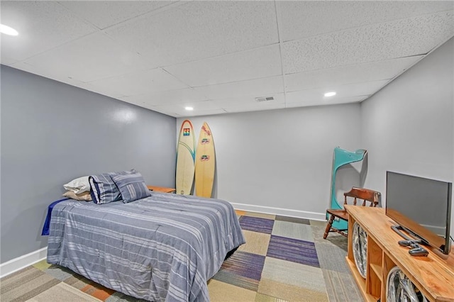 bedroom with a paneled ceiling