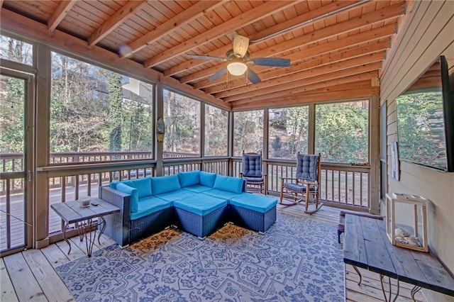 sunroom with ceiling fan, wood ceiling, and beamed ceiling