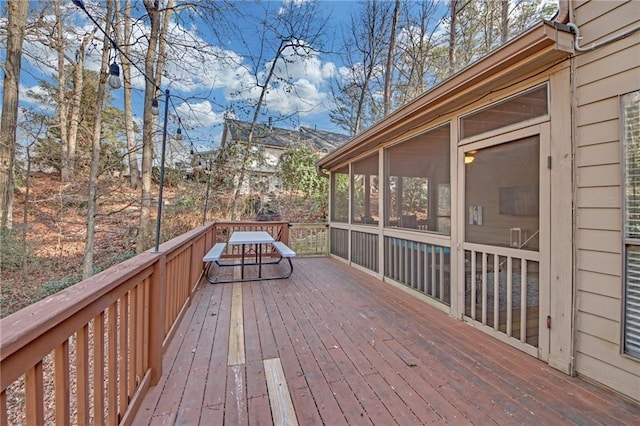 wooden terrace with a sunroom