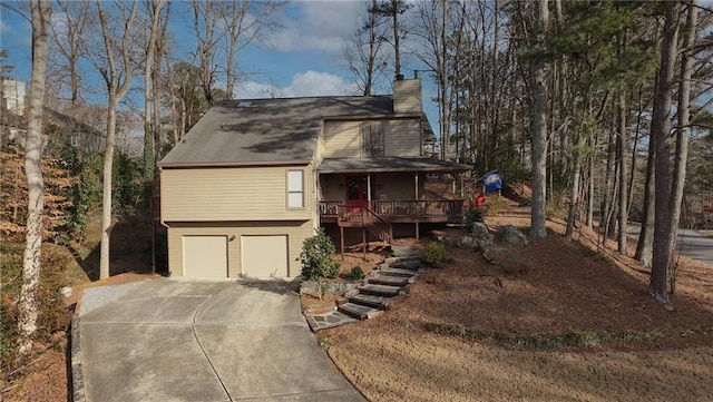 view of front of property featuring a garage and covered porch