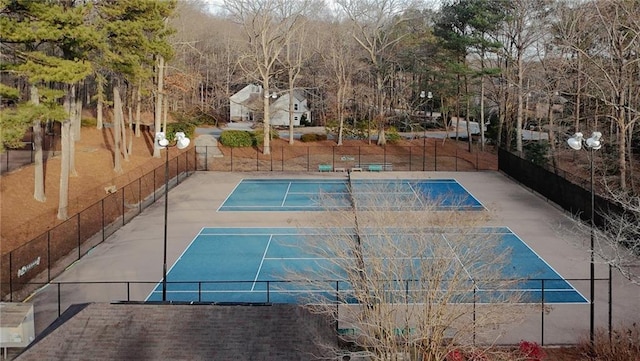 view of swimming pool with tennis court