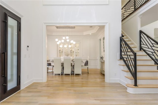 2461 Oak Grove Ests NE, Atlanta, GA 30345 - entrance foyer with stairway, wood finished floors, ornamental molding, baseboards, and a decorative wall