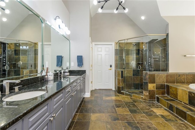 2461 Oak Grove Ests NE, Atlanta, GA 30345 - bathroom featuring double vanity, stone finish flooring, a shower stall, a bath, and baseboards