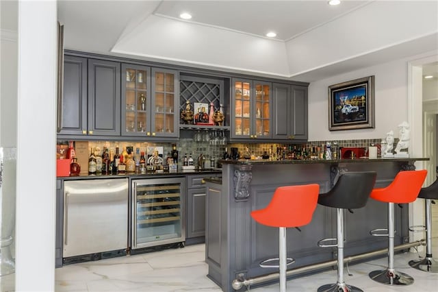 2461 Oak Grove Ests NE, Atlanta, GA 30345 - indoor wet bar with beverage cooler, tasteful backsplash, light marble finish flooring, refrigerator, and recessed lighting