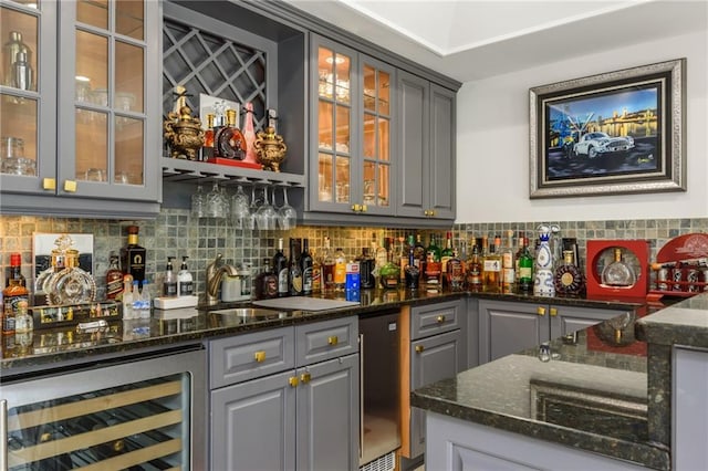 2461 Oak Grove Ests NE, Atlanta, GA 30345 - indoor wet bar with beverage cooler and backsplash
