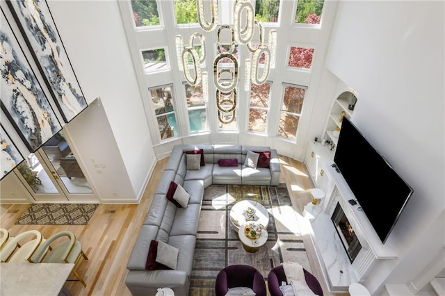 2461 Oak Grove Ests NE, Atlanta, GA 30345 - living area with wood finished floors, a towering ceiling, and baseboards