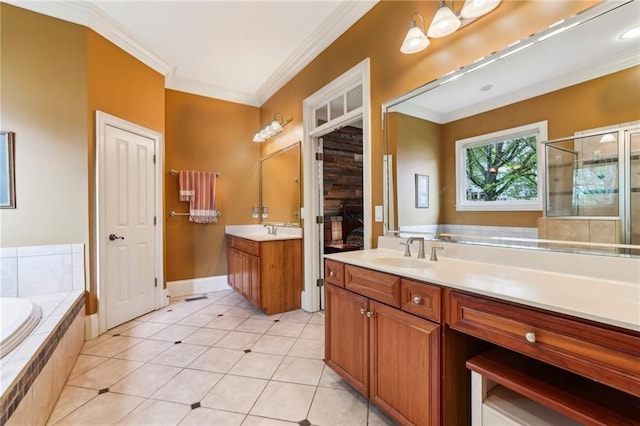 full bath with two vanities, crown molding, tile patterned flooring, a garden tub, and a shower stall