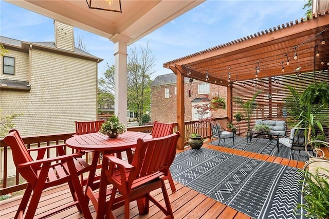wooden deck featuring an outdoor living space, a pergola, and ceiling fan